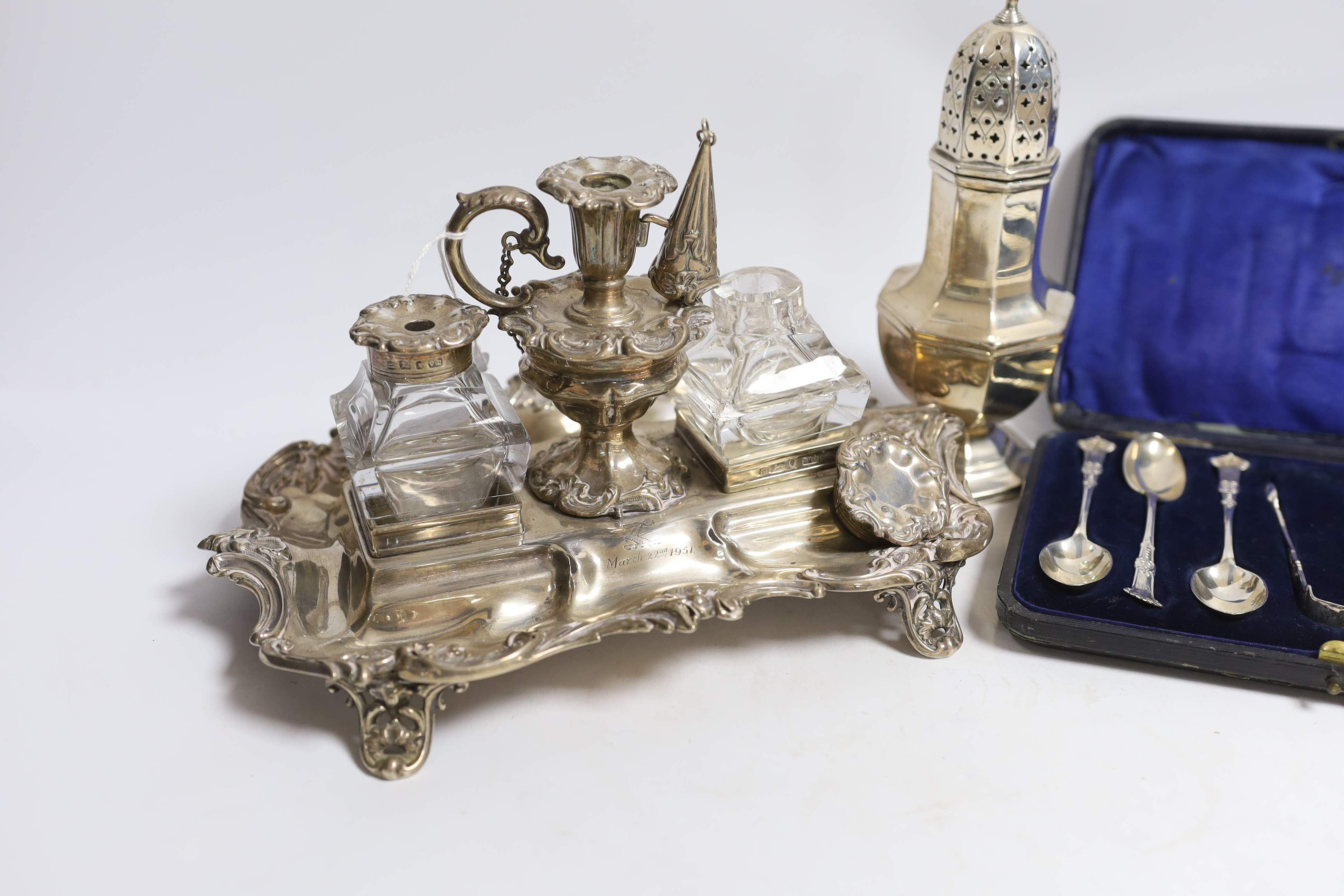 A Victorian silver inkstand, with two mounted glass wells and removeable taper stick, Henry Wilkinson & Co Ltd, Sheffield, 1841, 24.5cm, 15.5oz, together with a silver sugar caster and cased set of six silver teaspoons w